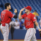 Under a plan proposed by MLB, superstars like Mike Trout (right) might earn only 44% of his prorated 2020 salary — over $35M — while teammate Shohei Ohtani (l.) would get more than 90% of his roughly $700,000 salary.
